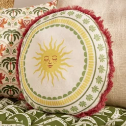 Coussin rond lin motif estival bord à franges Ø40cm (2 modèles soleil ou palmier)
