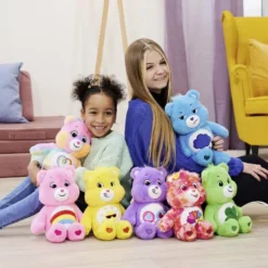 Peluche Bisounours assis multicolores 28x26xH35cm (6 modèles)