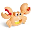 Pince à sable et coquillage forme crabe plastique (2 modèles)
