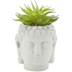 Tête Bouddha avec plante
